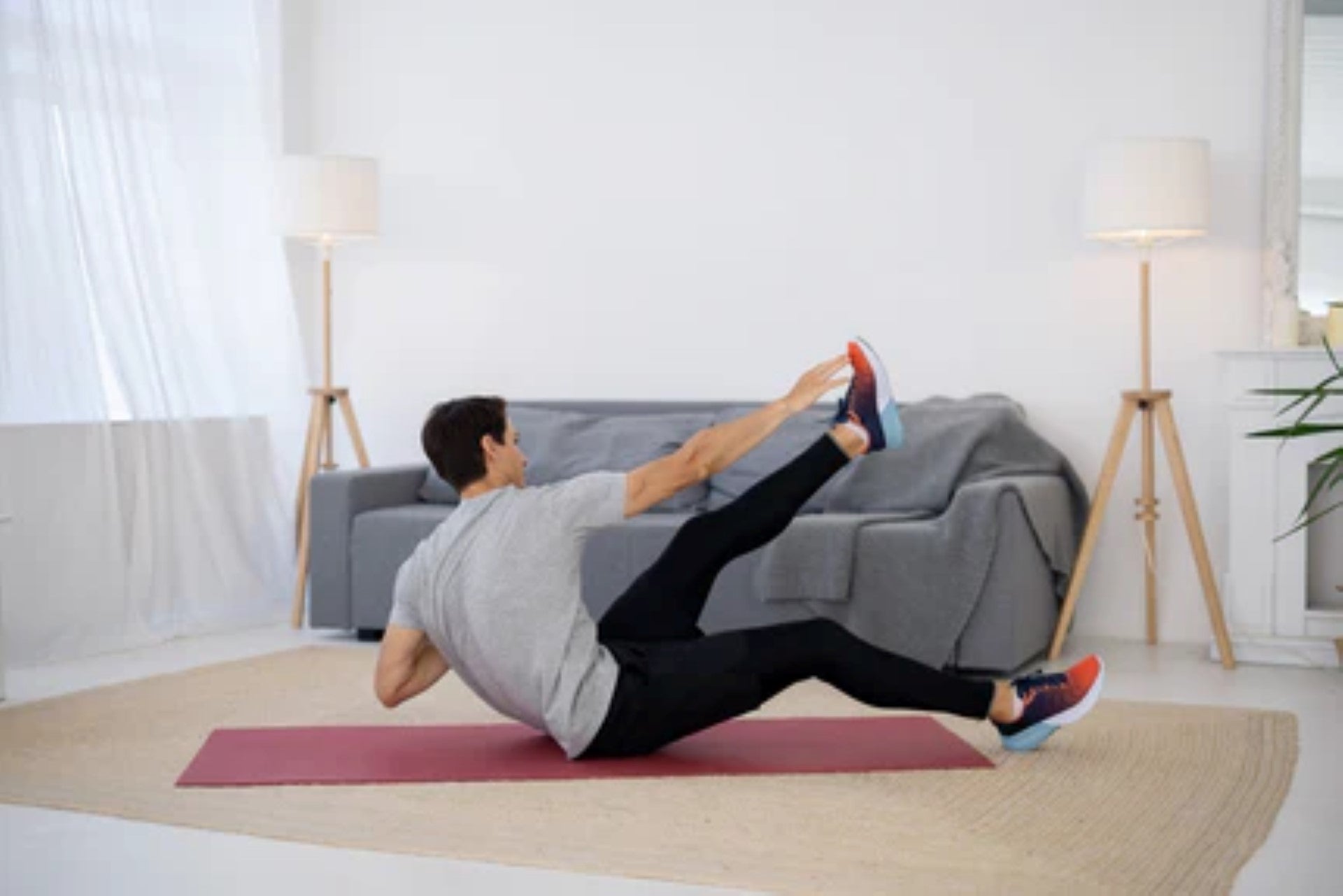 Individual engaged in a cross crunch workout at home, targeting core muscles and abdominal strength.