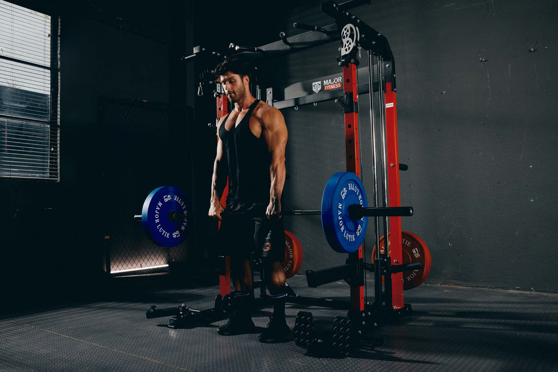 Person performing deadlift exercise with home gym equipment using a Smith machine.