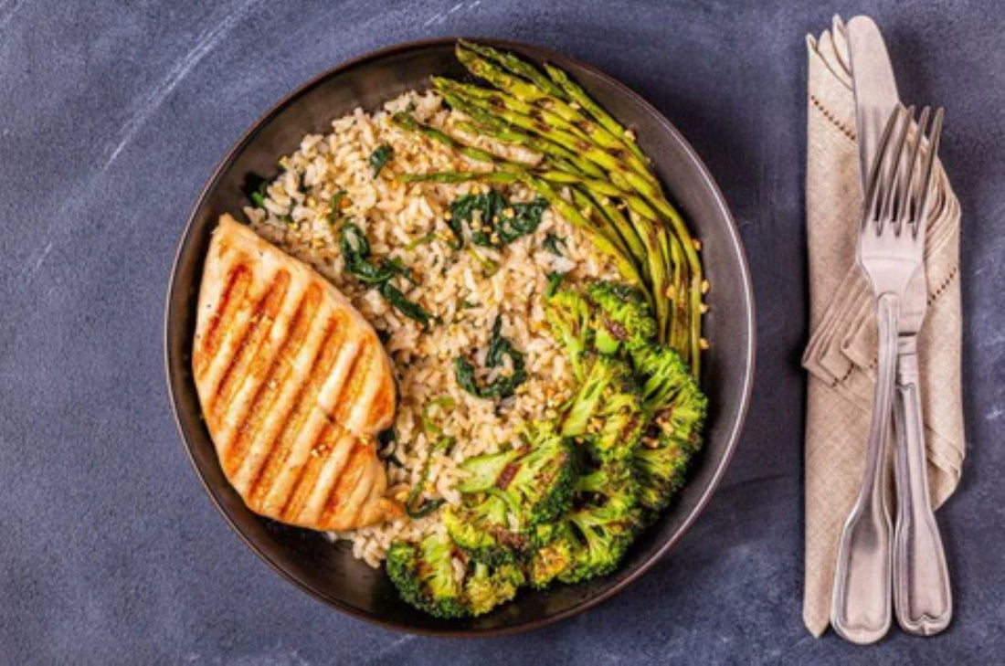 healthy meal featuring grilled chicken, brown rice, and roasted vegetables