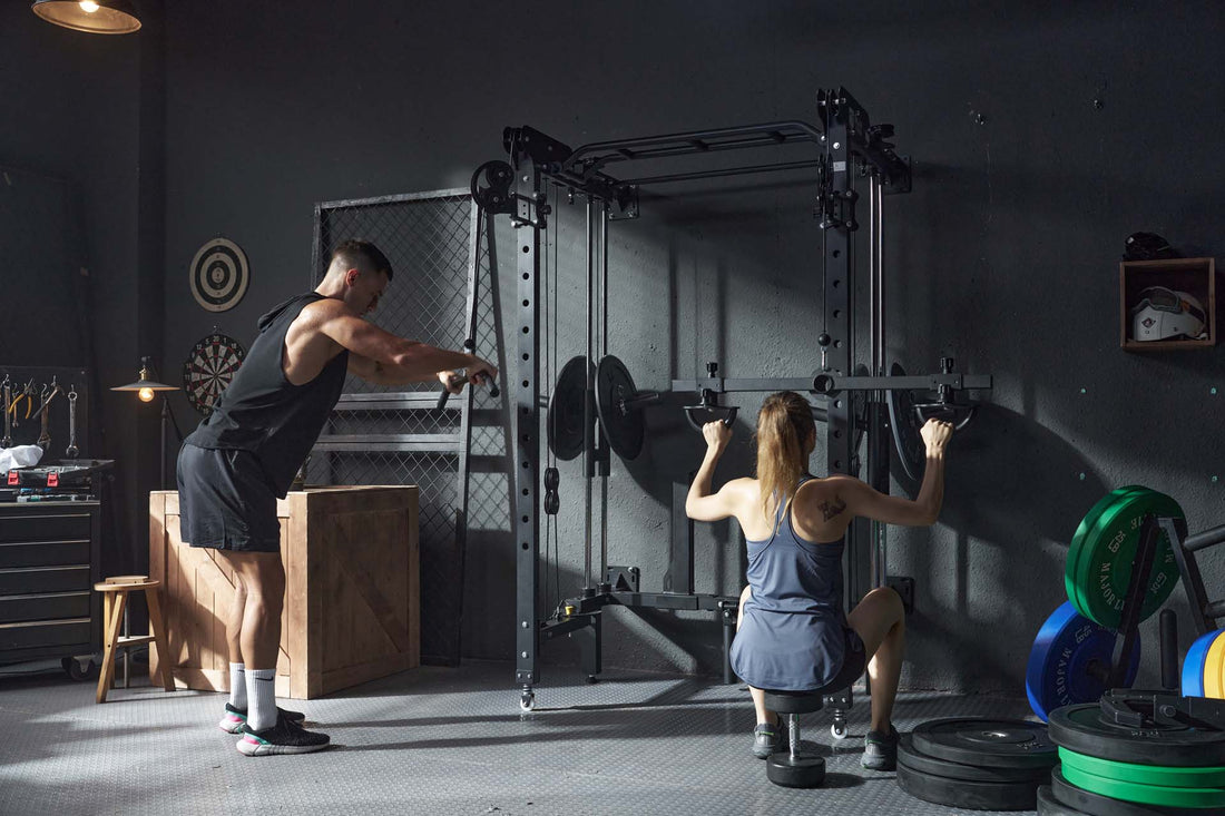 Male and female engaging in a workout session with a power rack in a home gym.