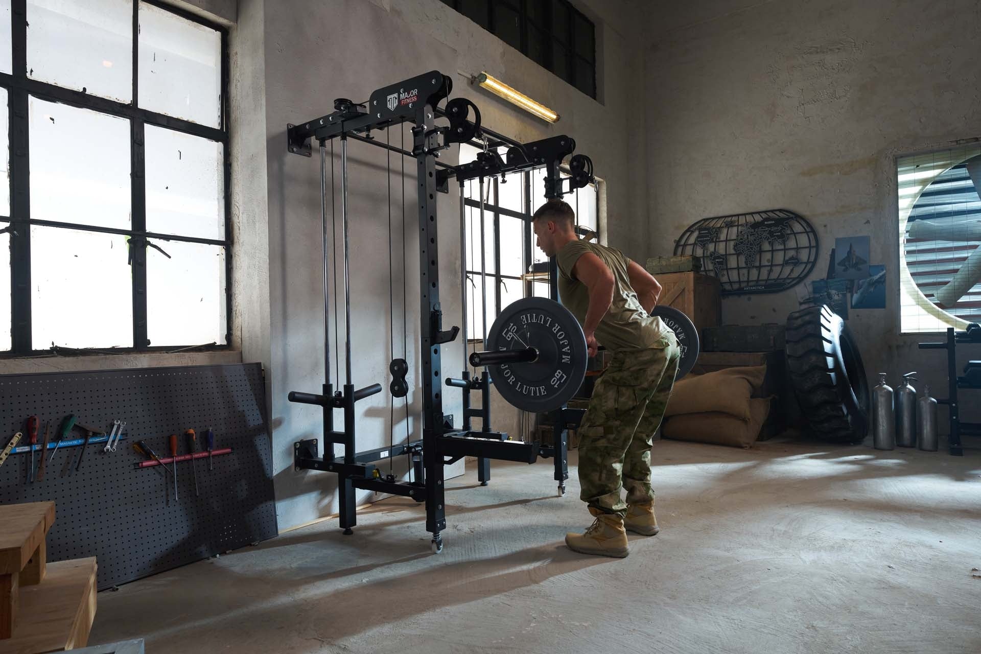 Strength training using a Smith machine in a home garage gym.