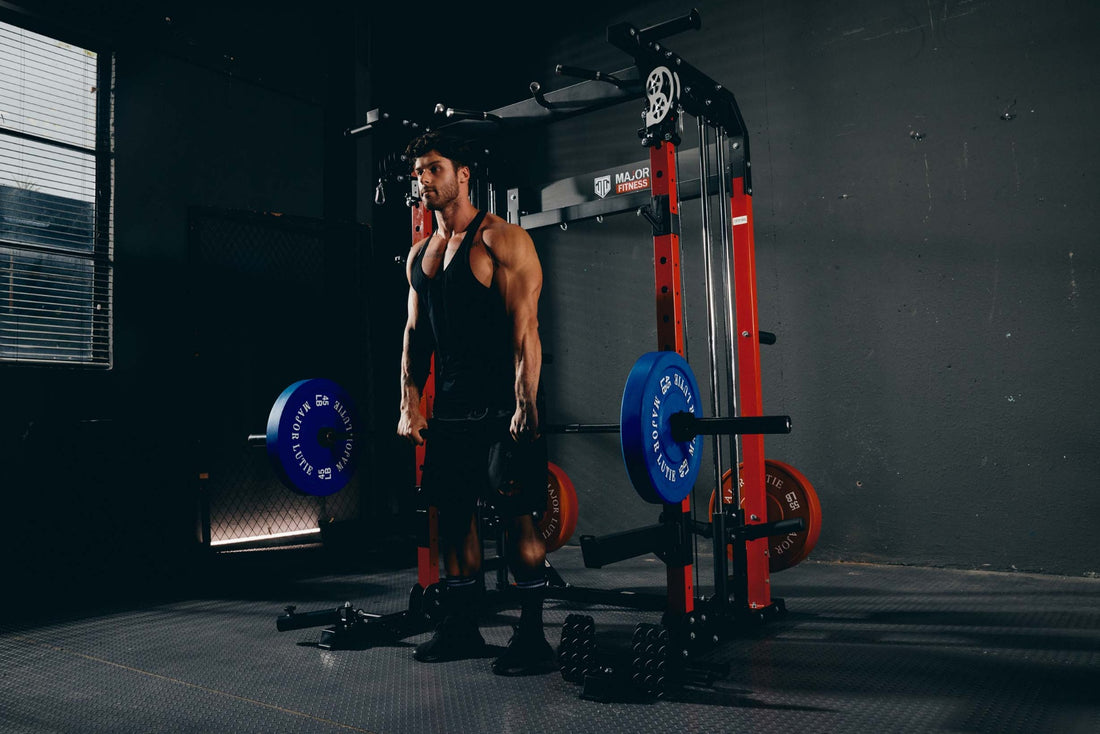 A man performing a barbell deadlift exercise in a home gym with a power rack.