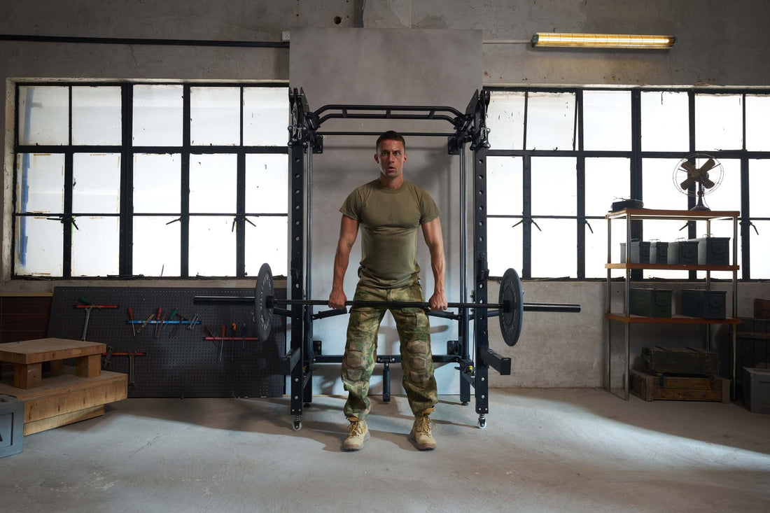 Person performing a deadlift exercise using a power rack in a home gym.