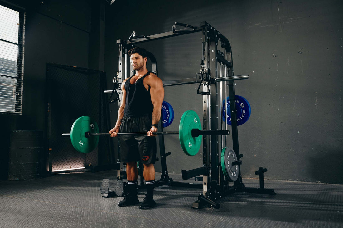 Man performing a deadlift with a barbell in a home gym.