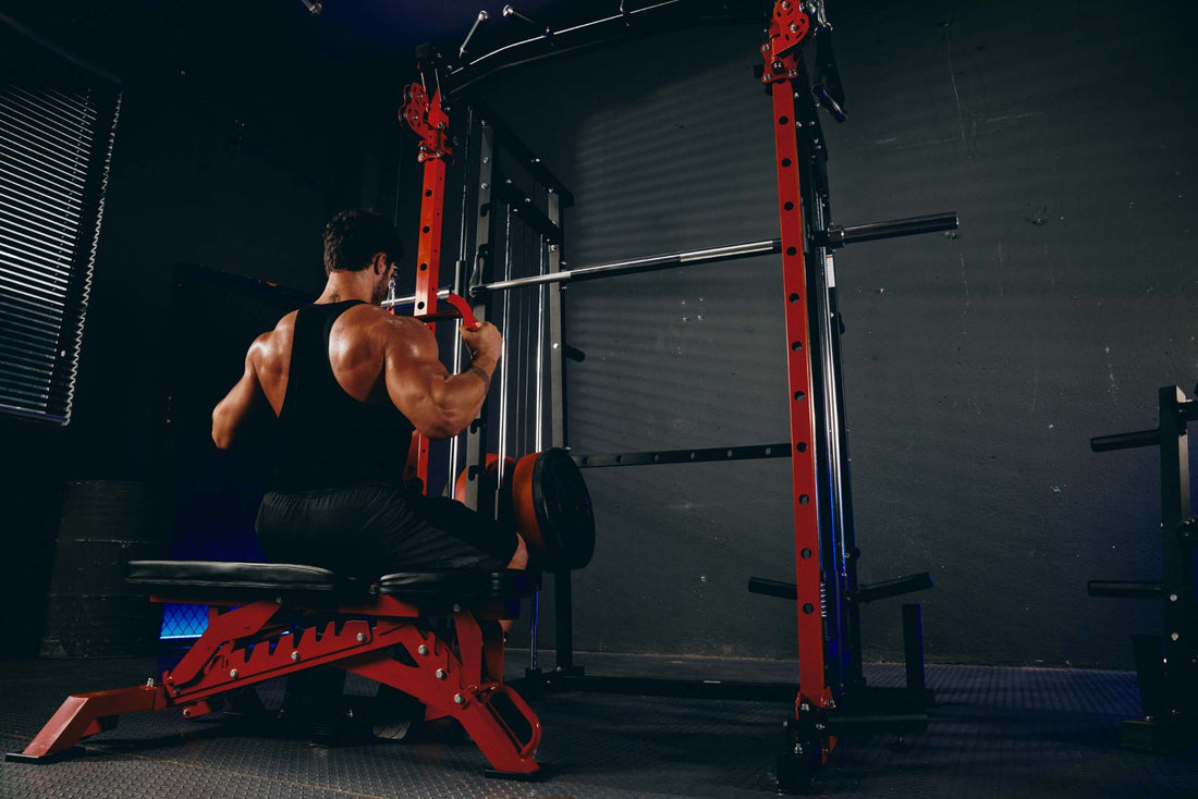 Person engaging in lat pulldown exercise using a Smith machine in a home fitness setup.