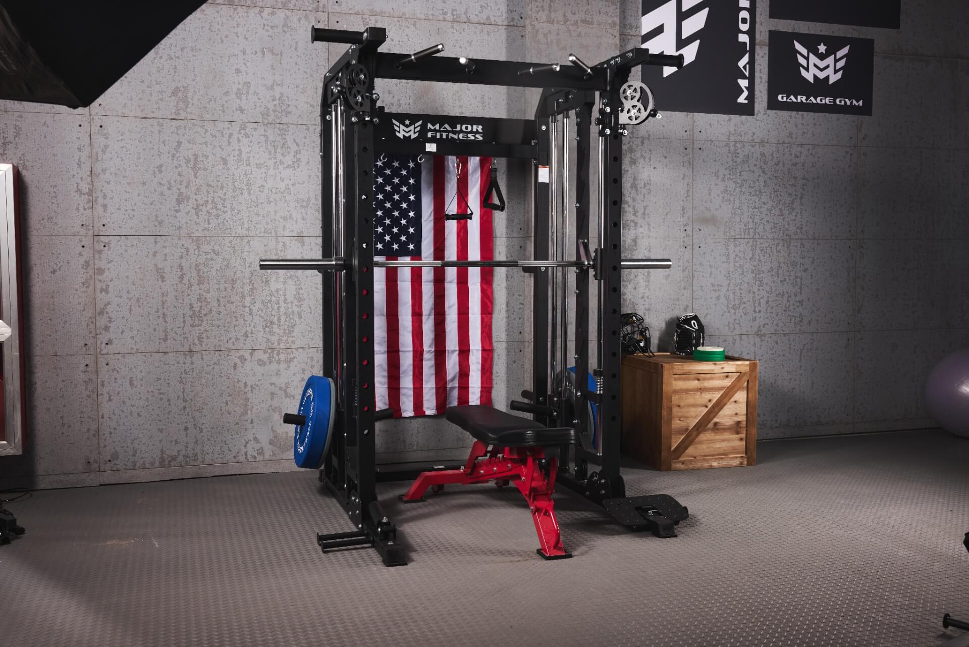 Strength training station in a home gym with a Smith machine and bench.