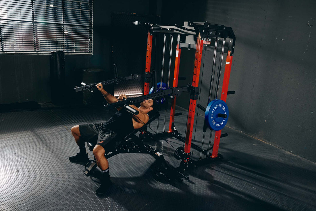 A man performing an incline bench press exercise in a home gym using a power rack.