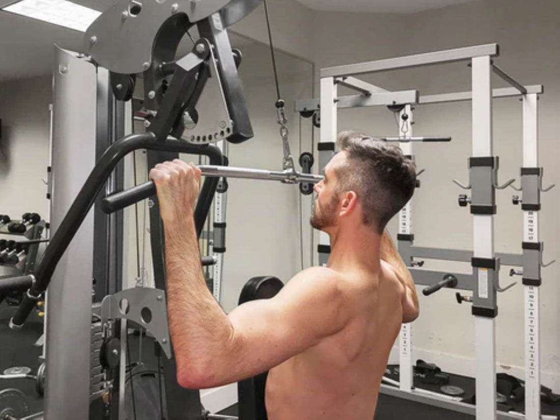 Person using a lat pulldown machine in a home gym for upper body workout.