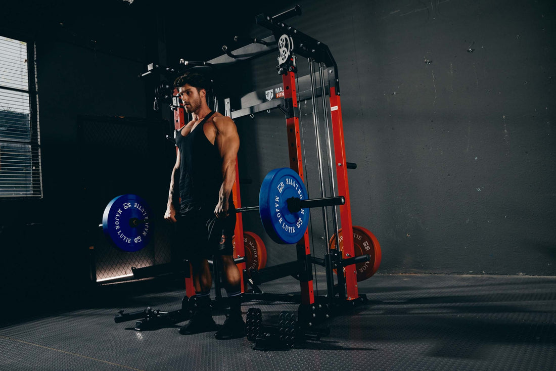 Individual doing a deadlift workout with Major Lutie Smith machine in a fitness room.