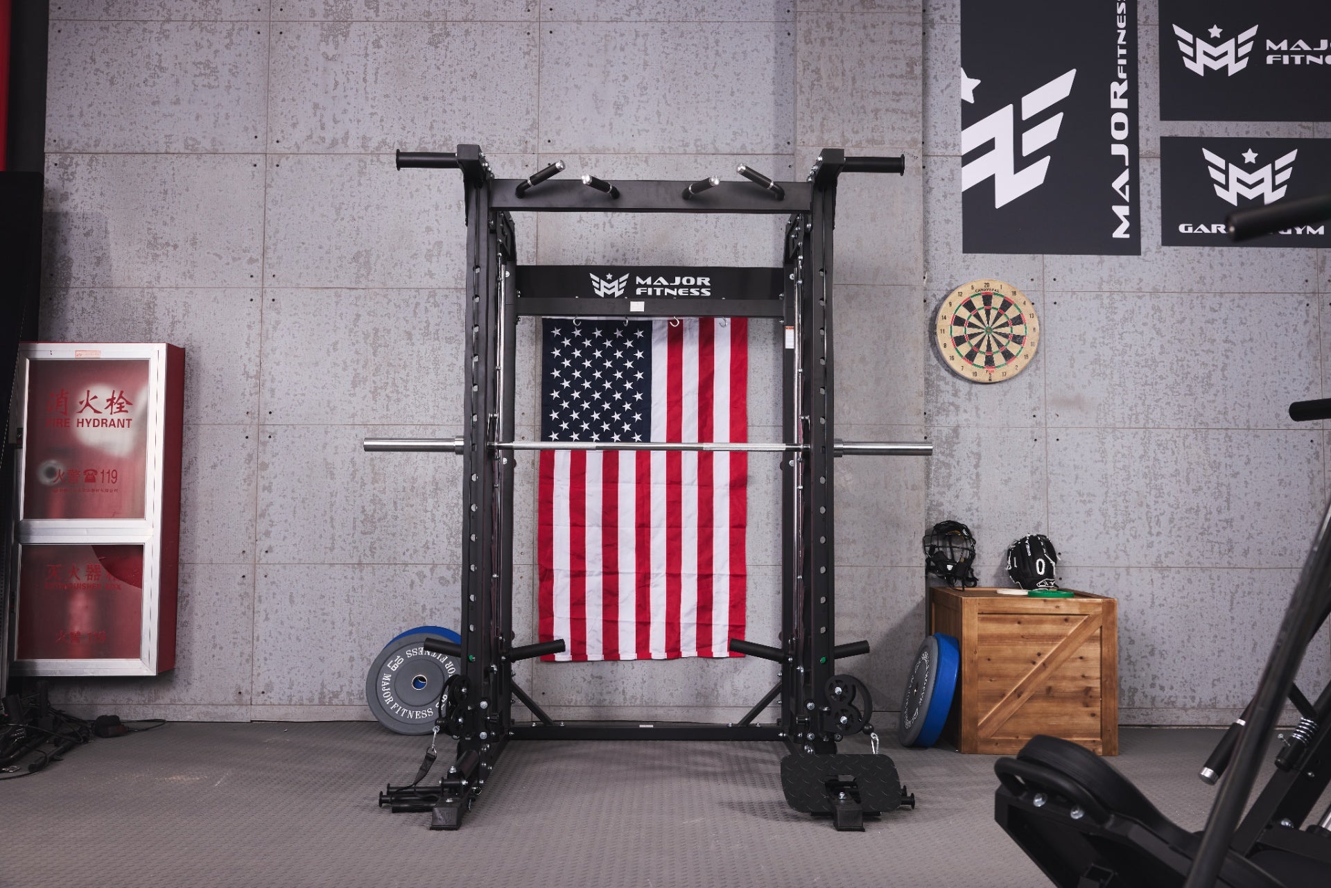 Home gym setup featuring a Smith machine with various weights and an adjustable bench.