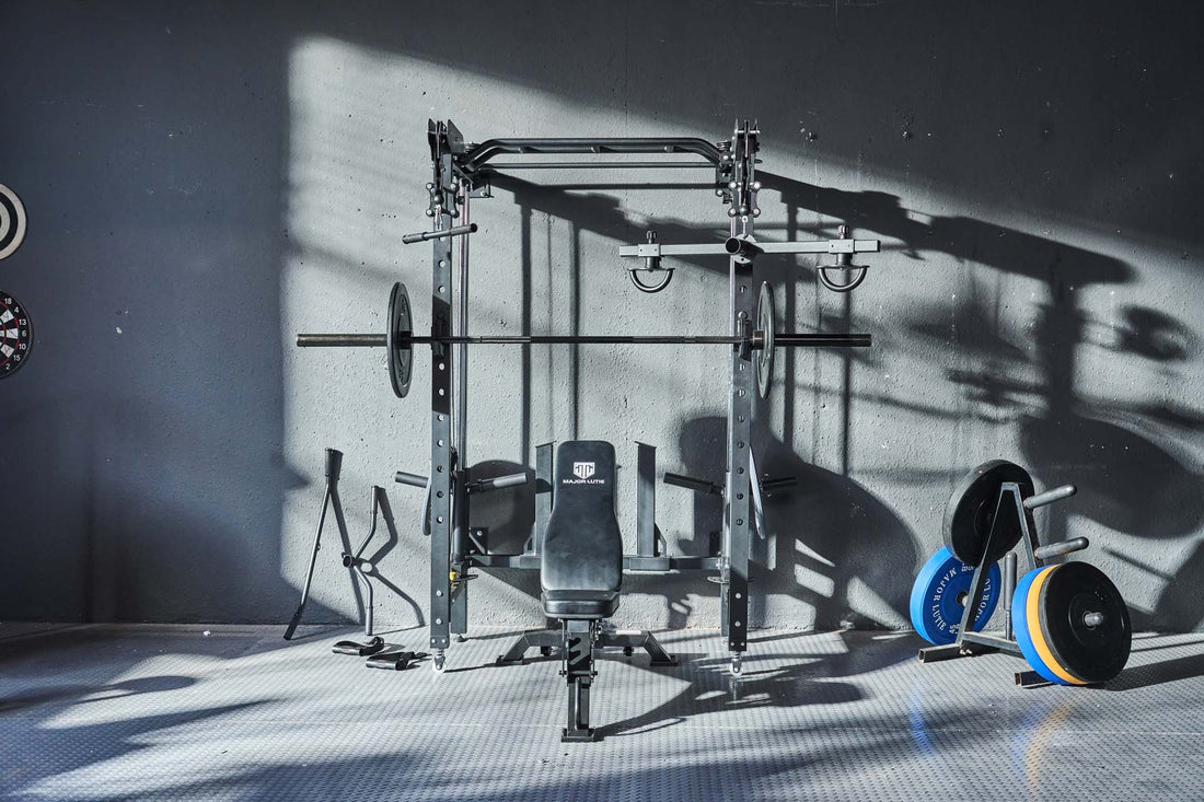 Home gym equipment including a power rack, weight plates, and a bench.