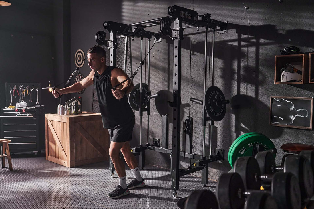 Male using cable machine for fly exercise in a home gym setup.