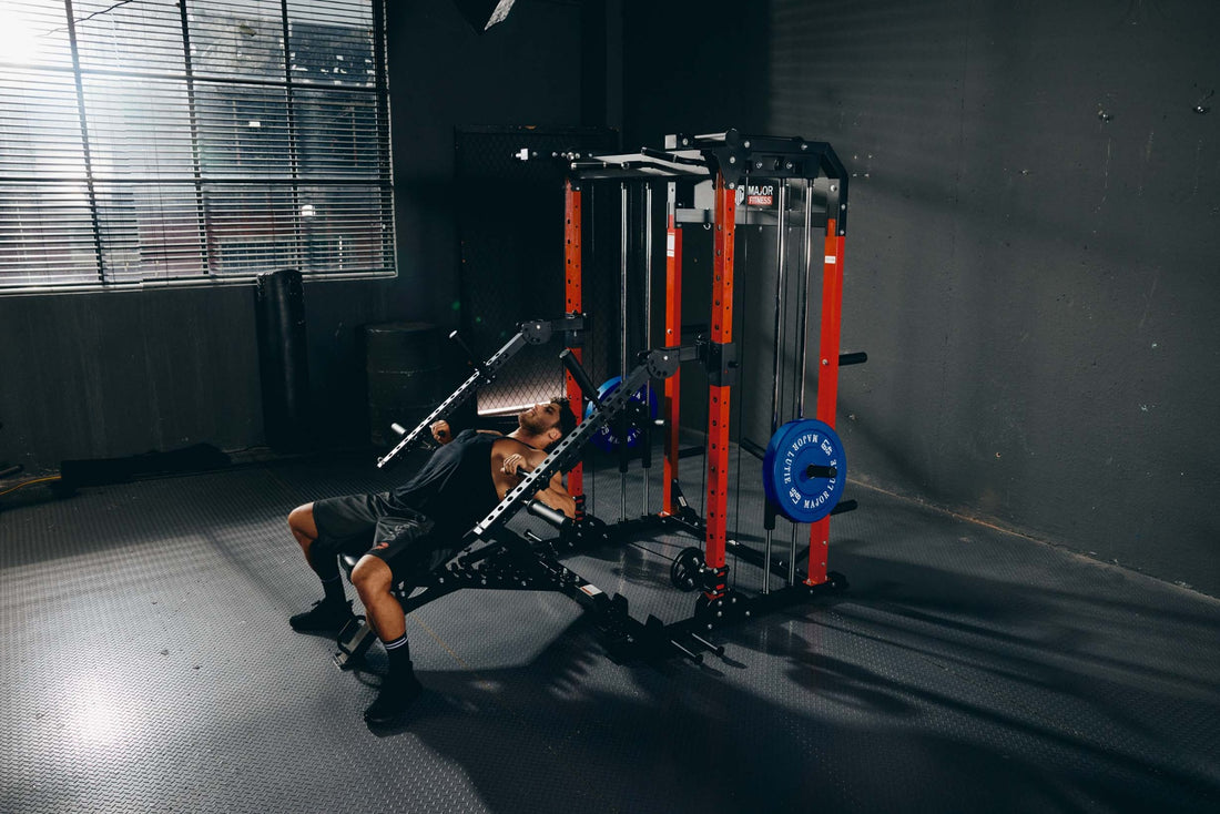 Man performing bench press exercise on a Smith machine in a home gym.