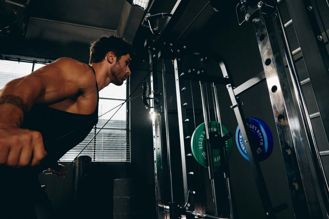 Functional training with a Smith machine and cable attachments.