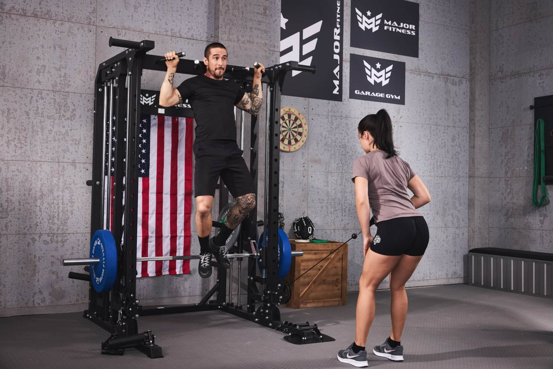 Man and woman working out together on a Smith machine with pull-ups.