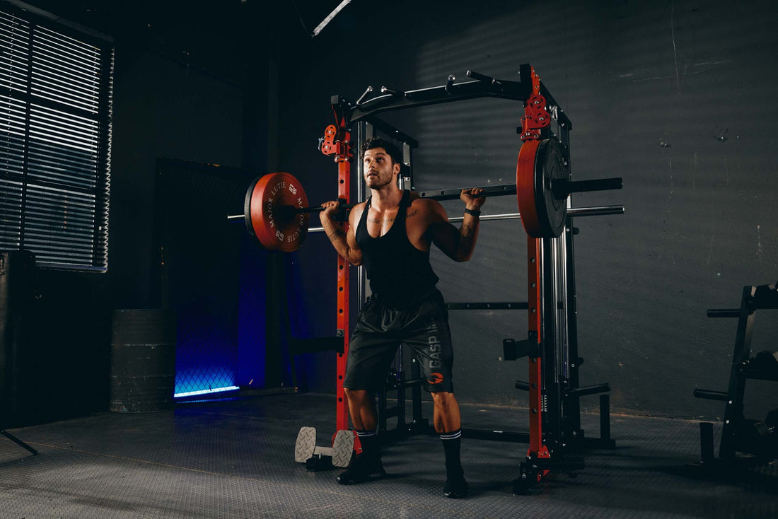 Individual doing a barbell squat exercise with a Smith machine in a home gym.