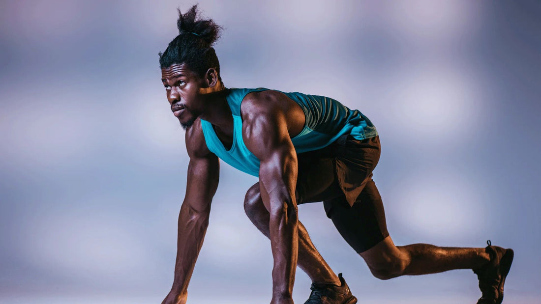 Track athlete positioned at the starting line, ready to sprint.