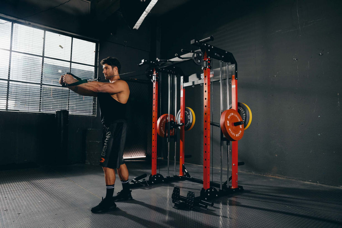 Man engaging in a cable workout in a home gym setup.