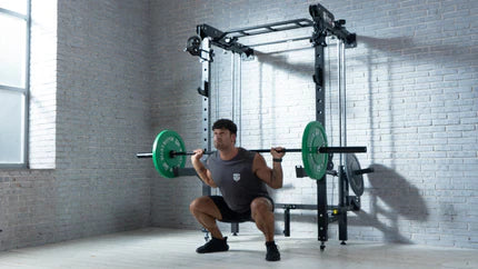 Strength training in a home gym with a Smith machine and barbell squat.