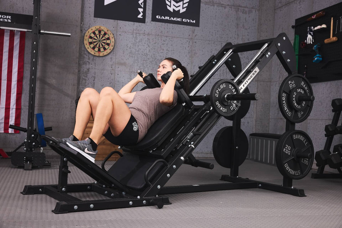 Woman using a leg press machine for strength training in a home gym.