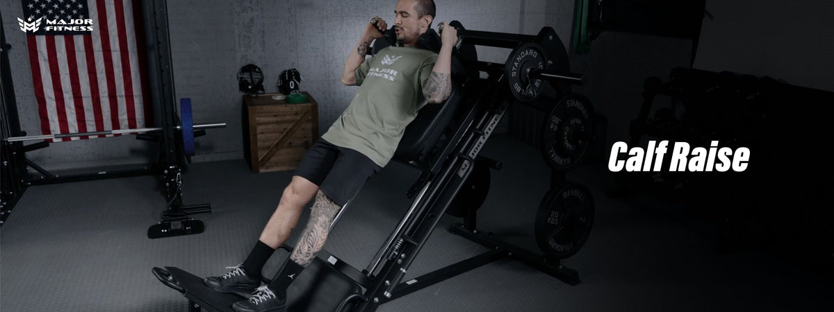 Man using hack squat machine to calf raise at home gym